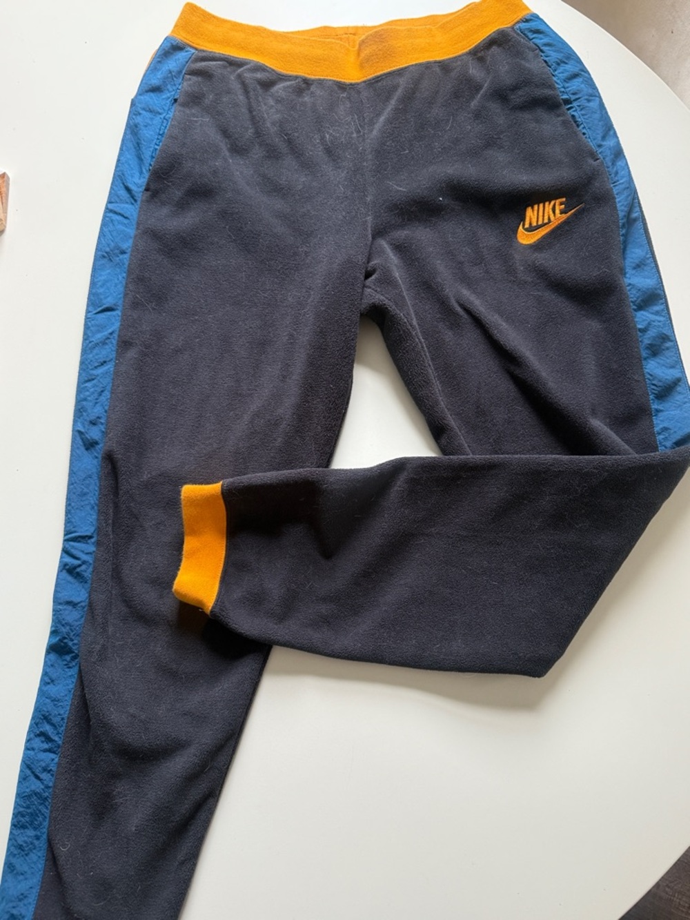 Nike Black Sweatpants with Blue Side Panels and Orange Accents